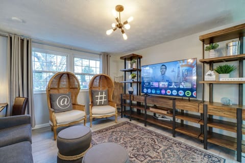 Relax in the stylish and cozy living room, complete with unique seating and a Smart TV perfect for streaming your favorite shows or movies.