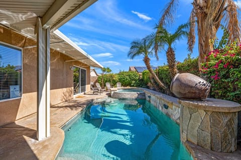 Private and heated swimming pool surrounded by landscape