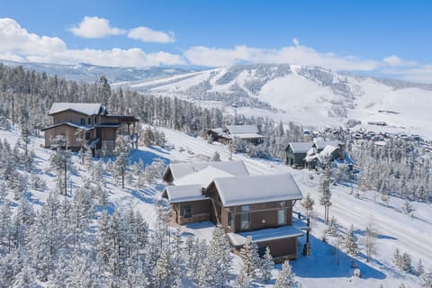 Aerial view of the home and property with some of the Granby Ranch slopes in the background