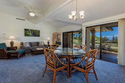 Bright and spacious living room with golf course views.