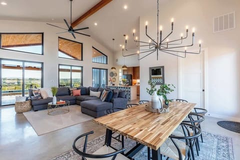 Large dinner table that opens up to the living room.