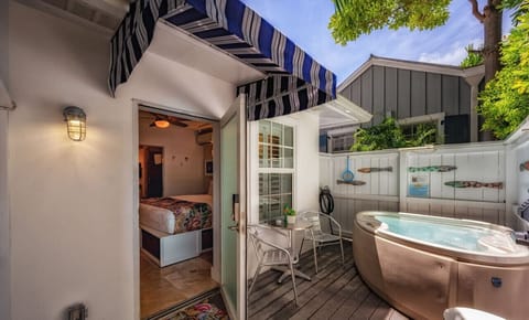 The front door to Starr`s Suite, your private bistro set for morning coffee, lunch, dinner over looking your PRIVATE 2 person Solana spa with jets at both ends, colored lights, water the temperature you want to enjoy.  There also LED lights.