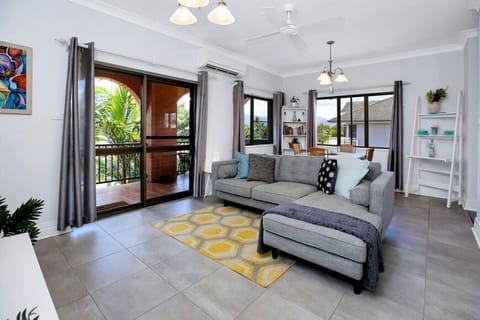 Lounge Room: Embrace the tropical breeze in this stylish lounge with balcony access! overlooking the northern end of the Cairns Esplanade