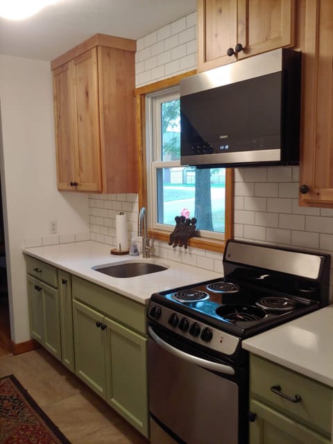 galley kitchen with stainless steel appliances