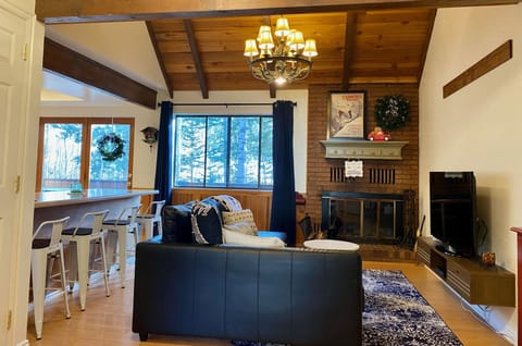 Cozy cabin condo has all the comforts of home, & a ski lift 30' from the deck.