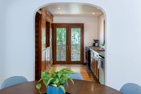 The view from the dining room into the kitchen.