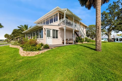 Access to the property first floor via the deck and second via the stairs