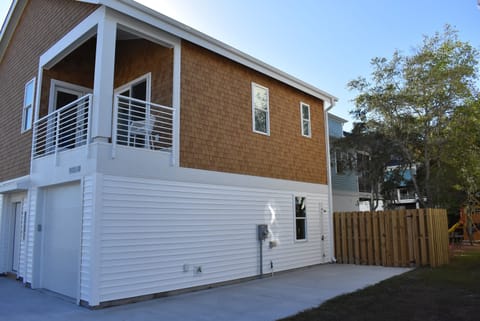Upper porch, outdoor shower, side driveway for additional parking