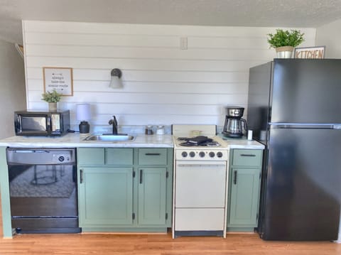 Efficiency kitchen is well stocked so you can prep small meals at the condo. 