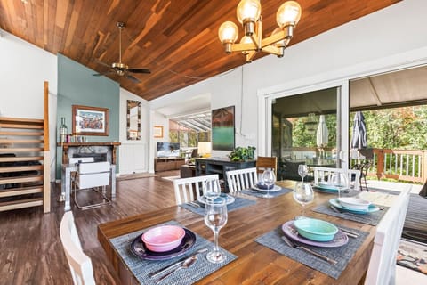 Enjoy the spacious great room with the sun room addition with the beauty of the forest outside and the warm fire inside