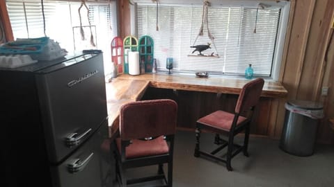 Breakfast nook with fridge. 