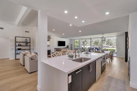 Kitchen Island: built in sink, dishwasher and microwave. Bar seating for three.