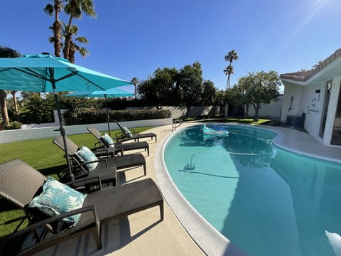 Swimming pool with LED lighting and outdoor shower. Fruit trees.
