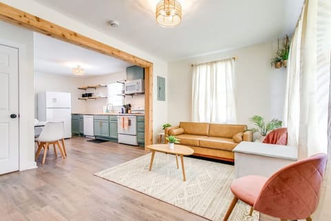 Living room with bathroom door on the left.