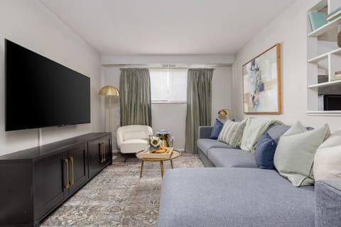 Unwind on this cozy sofa and immerse yourself in entertainment with the 55` TV