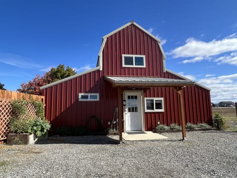 Barn sits off the road behind the main house with private drive.