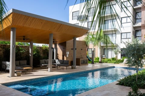 Outdoor Lounge: Relax under the stylish pergola, just steps from the sparkling pool!