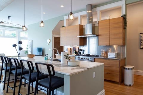Beautiful custom functional Kitchen! You'll find granite countertops, plenty of counter space, and cabinets for all your vacation goodies.