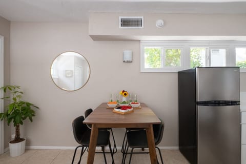 Gather for a meal or a morning coffee at this stylish wooden dining table. With comfortable seating for four and a bright, airy feel, it’s the perfect spot to plan your day's adventures.