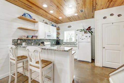 Fully stocked kitchen is primed for hosting BBQ cookouts and crafting delightful meals.