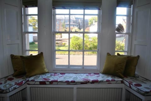 Relax in the kitchen and watch the world go by from the window seat