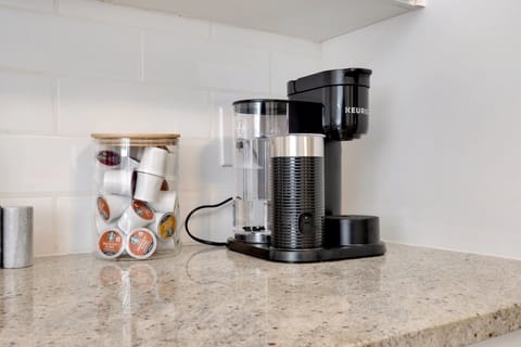 Coffee station featuring Keurig coffee machine and coffee capsules