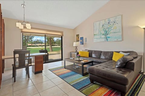 Most comfrotable bright living room with a small dining table of desk