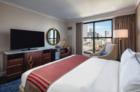 Settle in for movie nights with bright city-window backdrop.