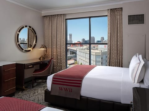 Catch up on emails at the desk beside sunny windows.