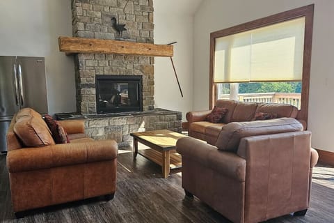 Main living room area w/ Gas fireplace and lounge seating