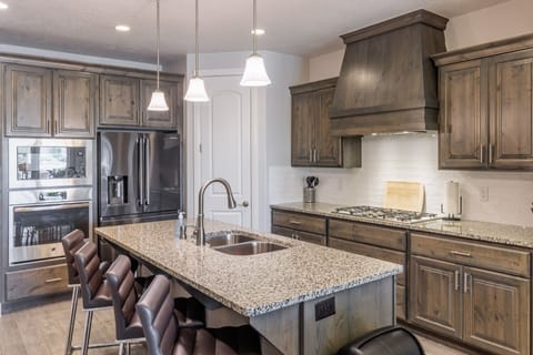 Kitchen - The kitchen is fully stocked with all the dishes, cookware, baking pans, and cutlery you will need for meal preparations and includes stainless steel appliances and granite counter tops.