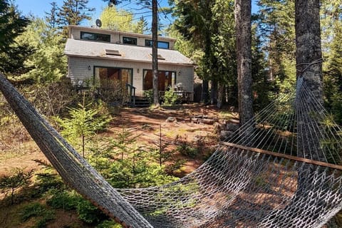 On the path from the cottage to the pond is a hammock to enjoy a book or a nap.
