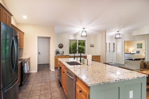 Kitchen island looking at the garage door entrance and second bedroom