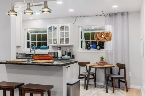 Bar stools and dining nook in kitchen
