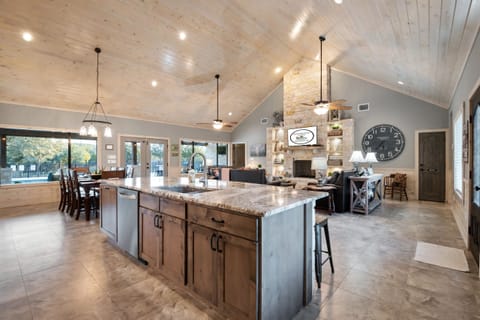 The breakfast bar overlooks the living and dining room and out to the pool.