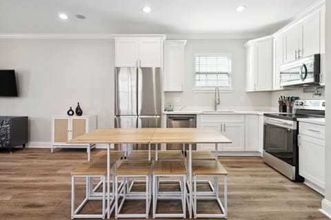 Kitchen- well equipped, ice maker, water dispenser, pot filler, stovetop and oven, coffee maker, coffee, creamer, sugar, filters, wine glasses