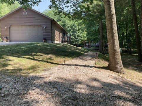 Walk path from parking area to private entrance.