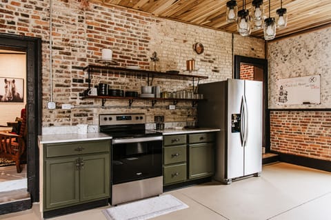 Fully equipped kitchen w/all modern amenities, maintaining the historical charm
