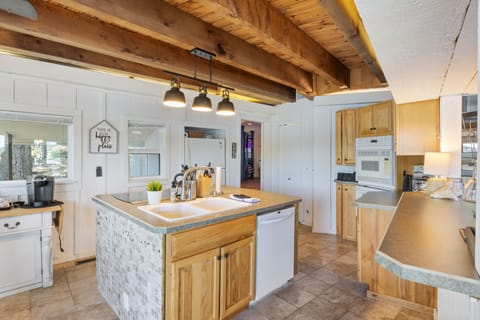 Center Island Countertop with Attached Sink Offers Convenience to Meal Prep and cooking.