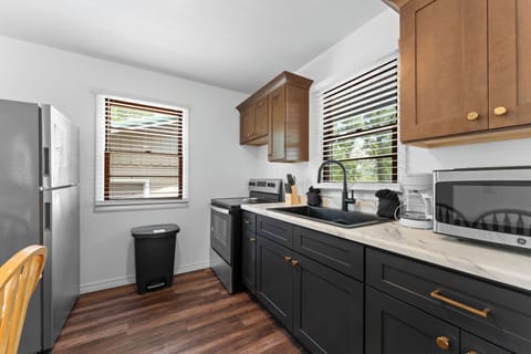 Charming and efficient this small kitchen and dining area makes every moment feel intimate and delicious.