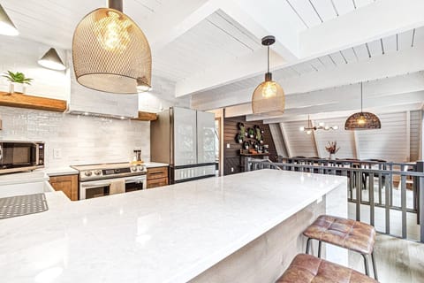 Breakfast area with couple counter stools. 
