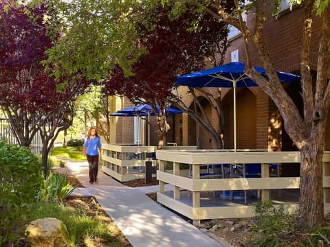 Wander shaded paths and enjoy quiet corners throughout the property.
