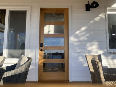 Front door custom design and solid Honduran wood.  