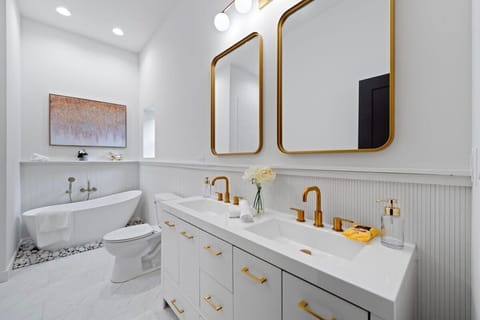Clean bathroom view w/ modern fixtures & a fresh, airy feel.