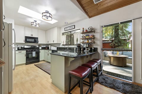 We'll be in the kitchen! Or perched on a stool looking into the kitchen.