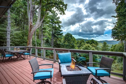 Outdoor deck with fire table, patio table and sectional seating (not shown).