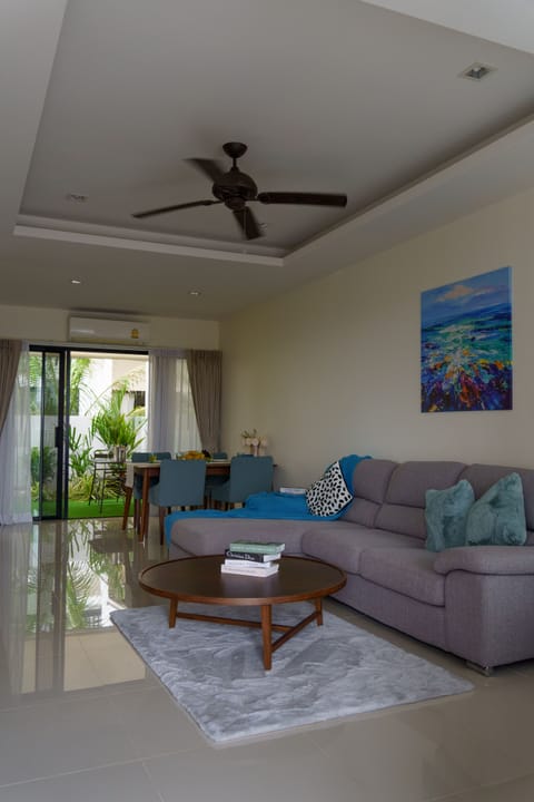 Big living room with a kitchen and a back yard