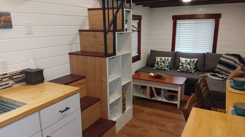 Stairs to bedroom with loads of storage