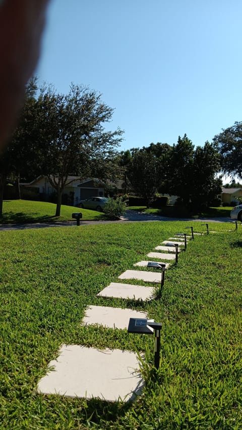 Parking space with walking path  to the entrance gate. 