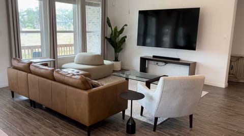 Main living room witb 85” TV and Surround Sound